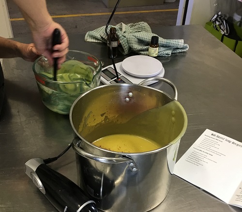 Mixing coloured micah into the soap mixture