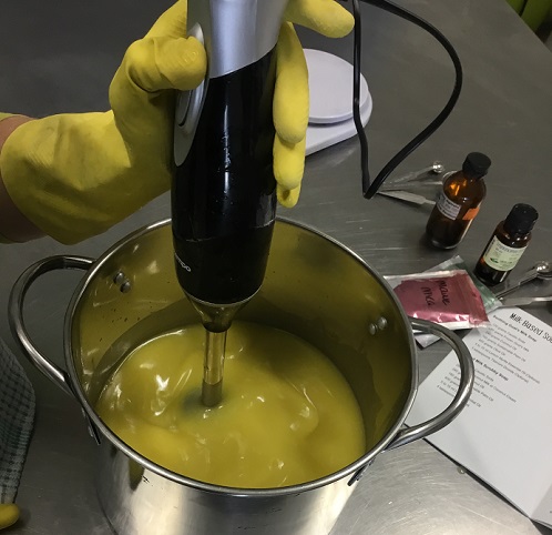 Mixing soap mixture with a stick blender